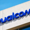 Blue Qualcomm logo on a building facade