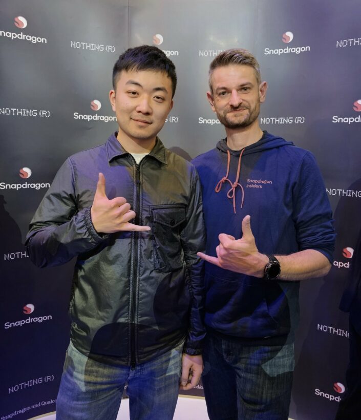 Carl Pei and the article's author posing together at a Nothing and Snapdragon event, both making shaka signs