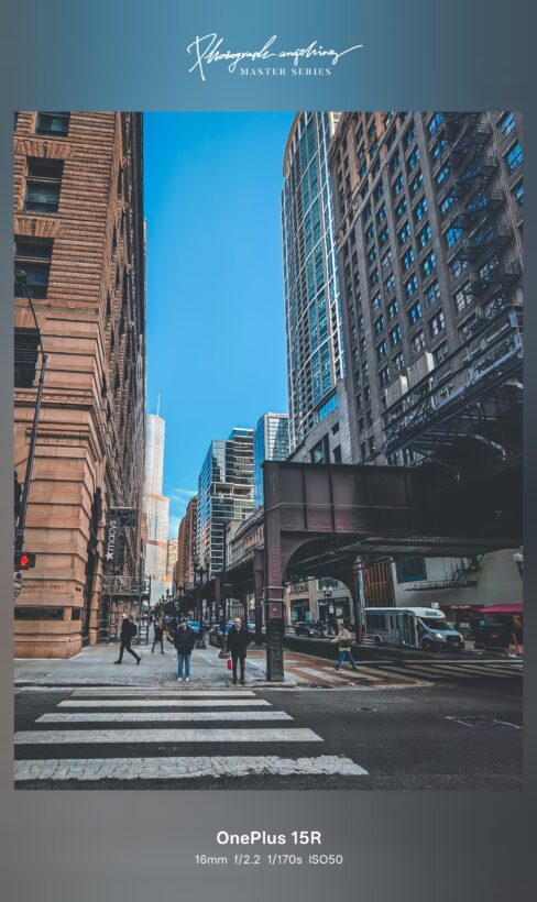 OnePlus 15R ultrawide camera sample: Chicago street canyon with elevated train tracks, shot at 16mm f/2.2