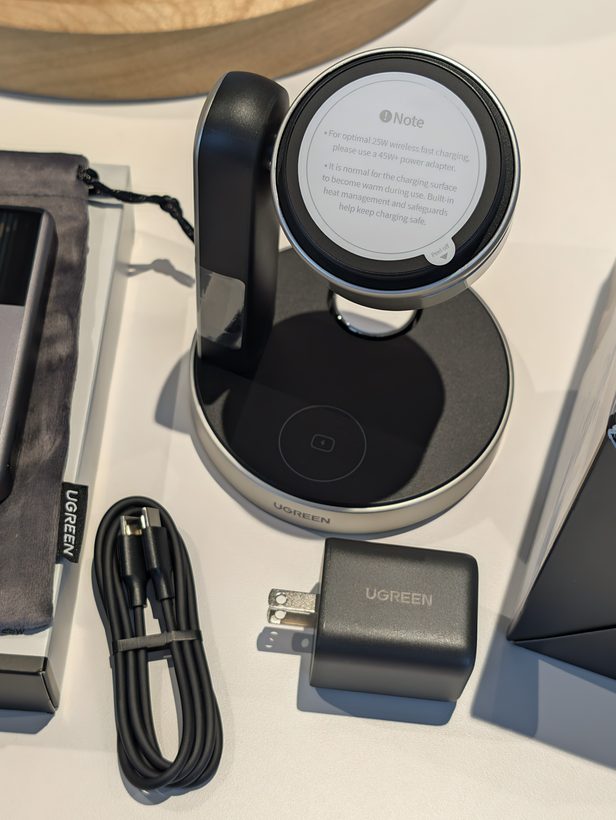 UGREEN 3-in-1 charging stand with magnetic puck, USB-C cable, and 45W power adapter laid out on a table