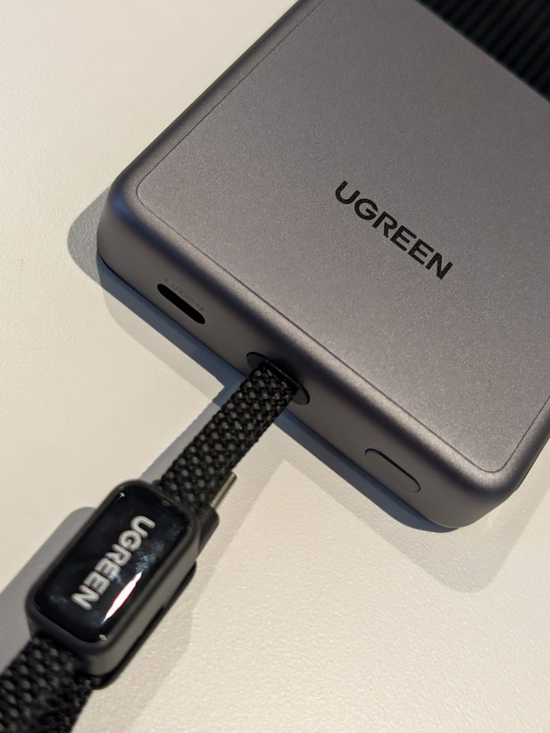 Close-up of the UGREEN MagFlow Pro's built-in braided USB-C cable connector sitting slightly proud of its body recess