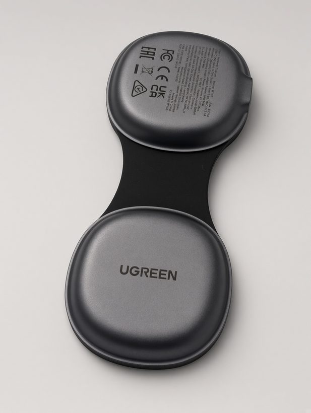 UGREEN foldable 2-in-1 charger unfolded flat, showing two round pads joined by a hinge, with logo and certification markings